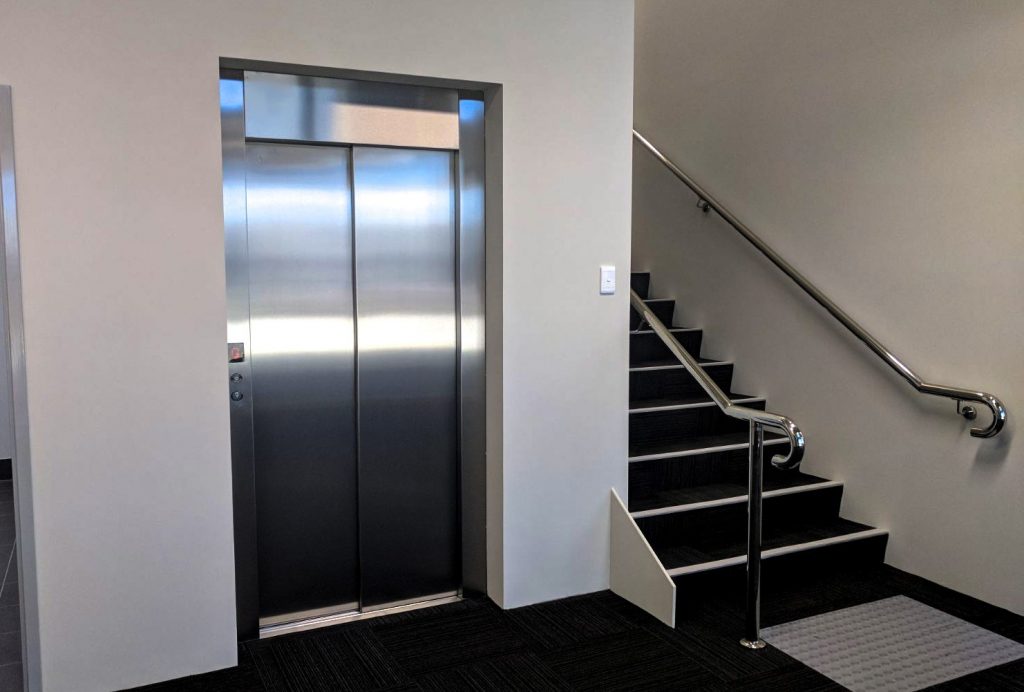 Closed doors of a commercial Lift Next To Stairs in Bibra Lake