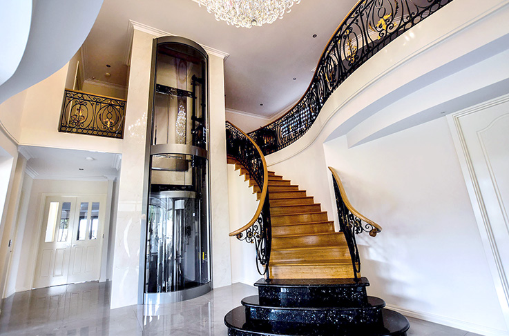 Mariginiup luxury residential round panoramic lift next to staircase