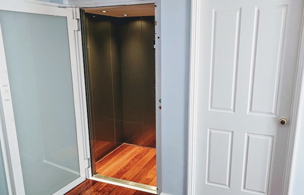 Open glass door of a residential lift in Mount Pleasant