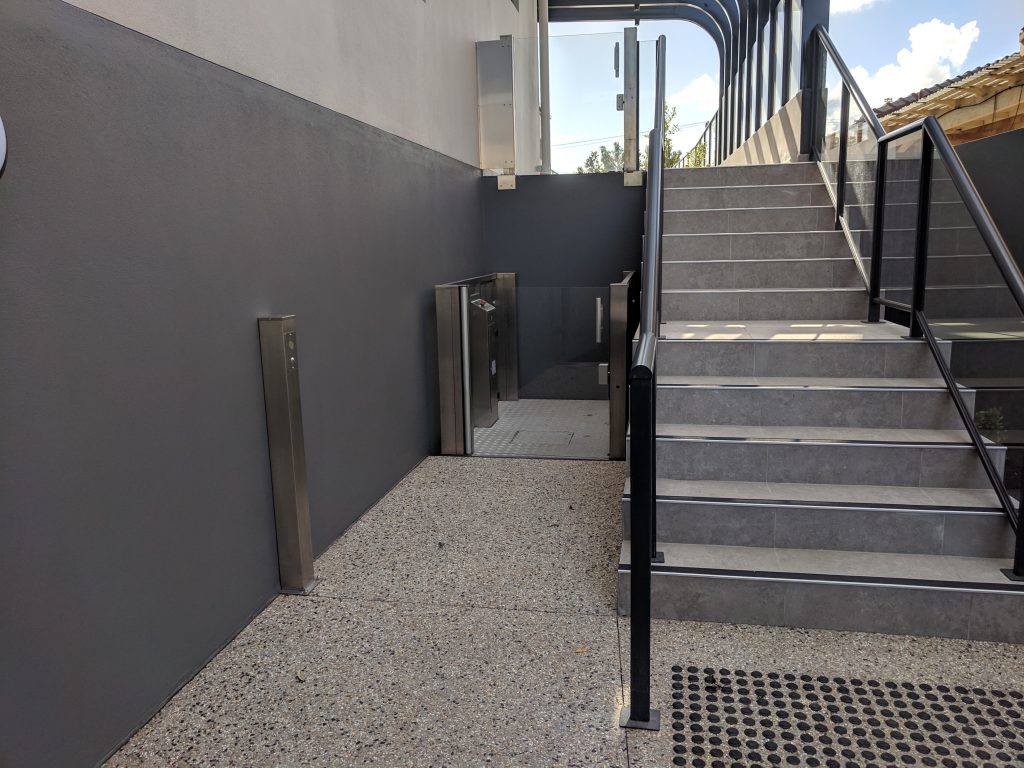 Outdoor Wheel chair lift next to stairs in Booragoon