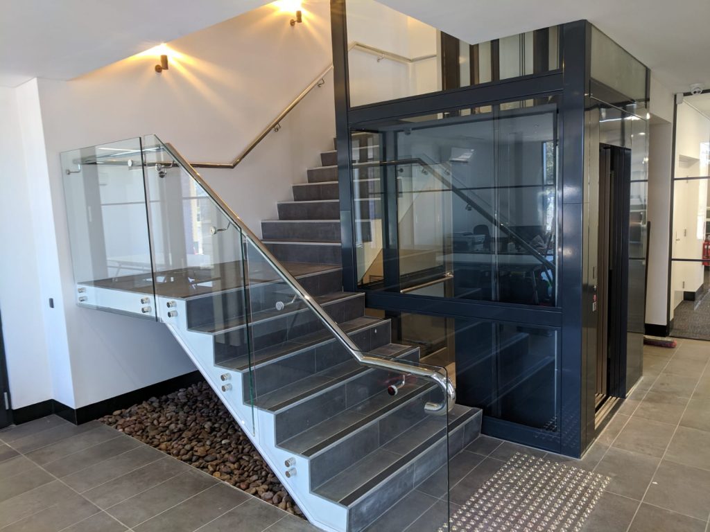 Katanning commercial lift with stairs wrapping around it