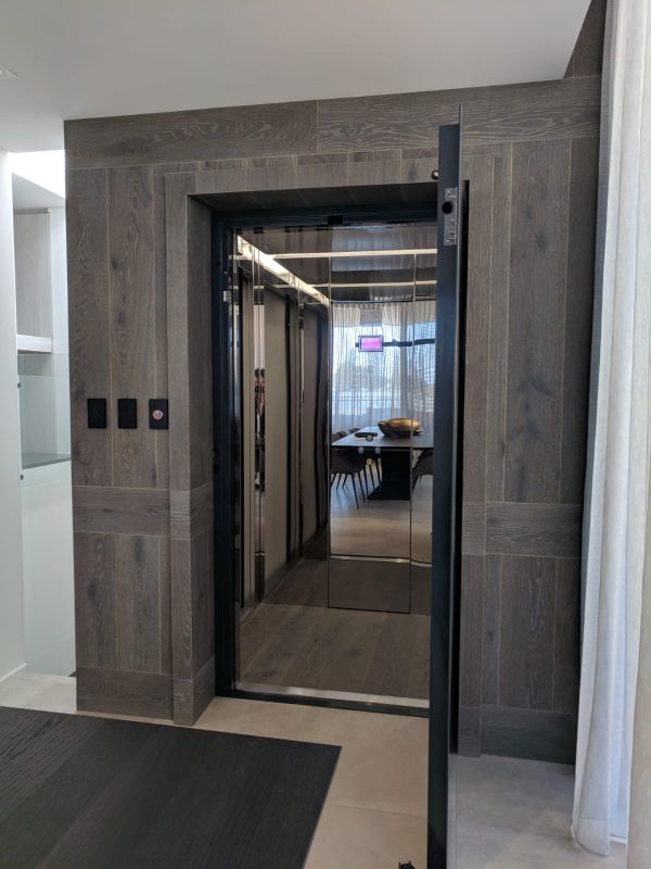 Open swinging door of a residential lift in East Fremantle