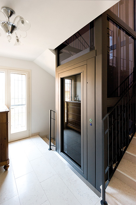 matte black sovereign home lift on landing between floors