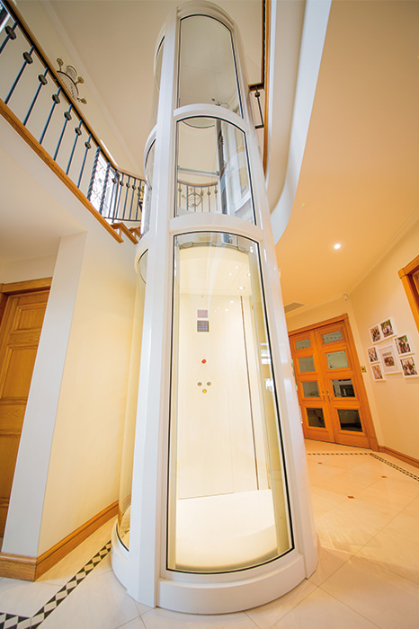 luxury round home lift with white detailing