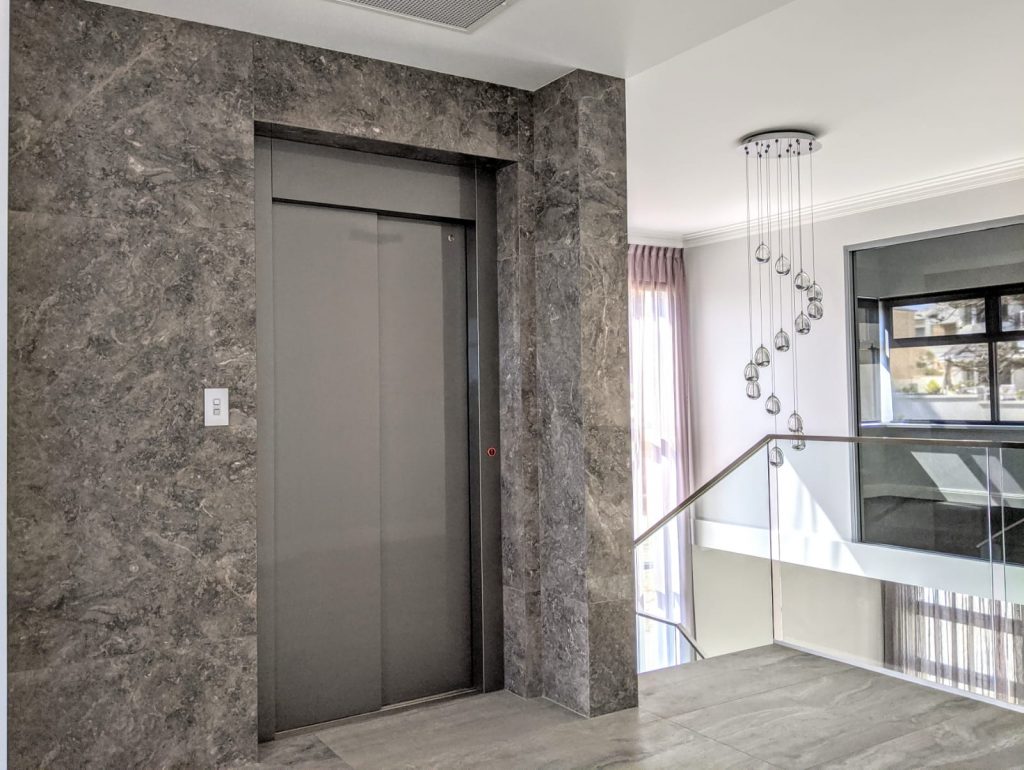 Closed grey doors of an lift installed in a North Beach residential property