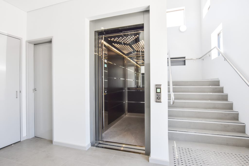 large elevator with doors open in hospital