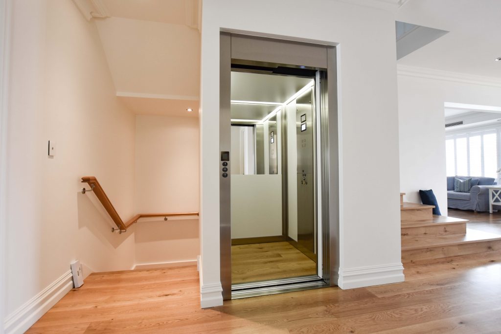 Perth residential lift at the top of the stairs with doors open.