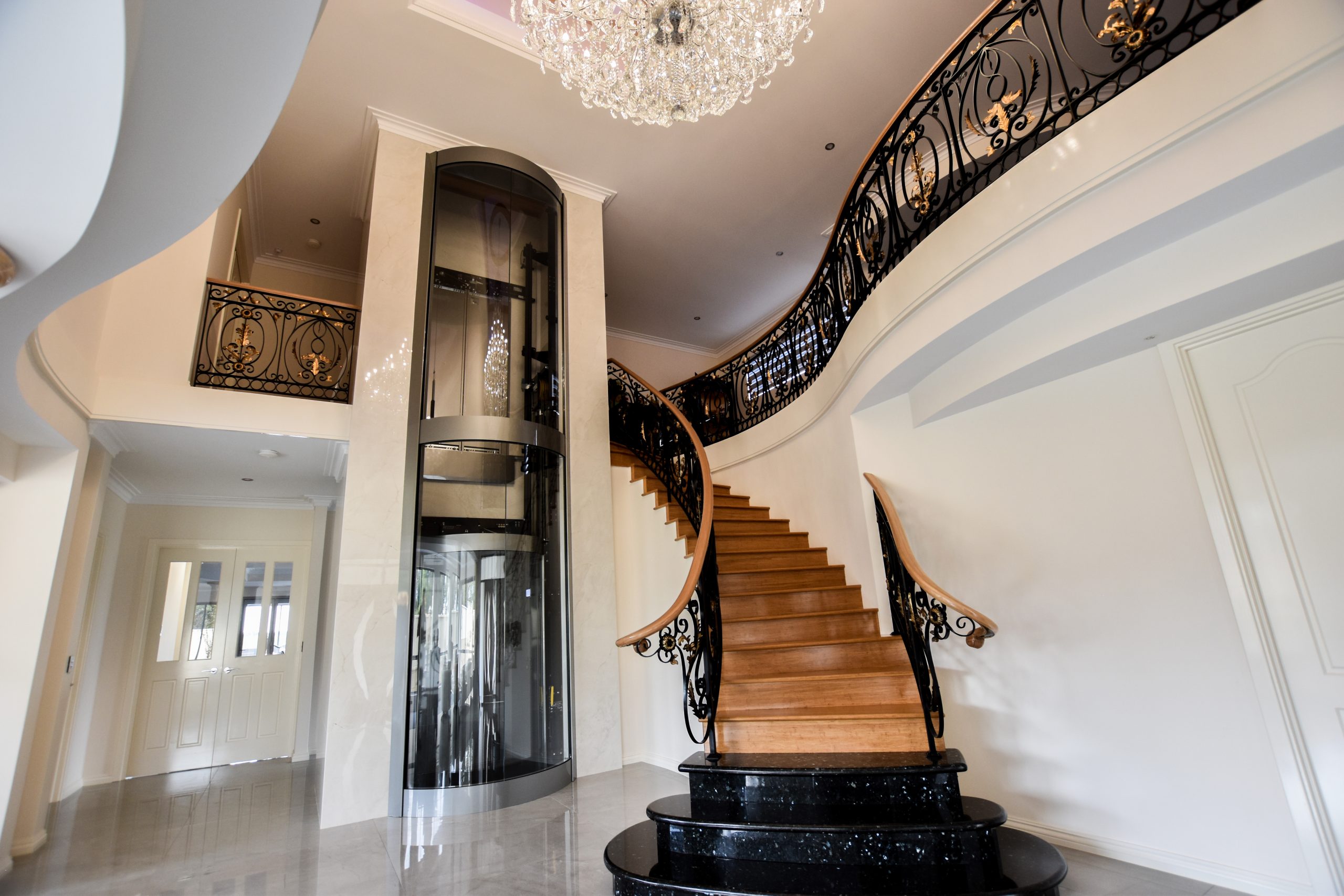 residential lift next to stairs.