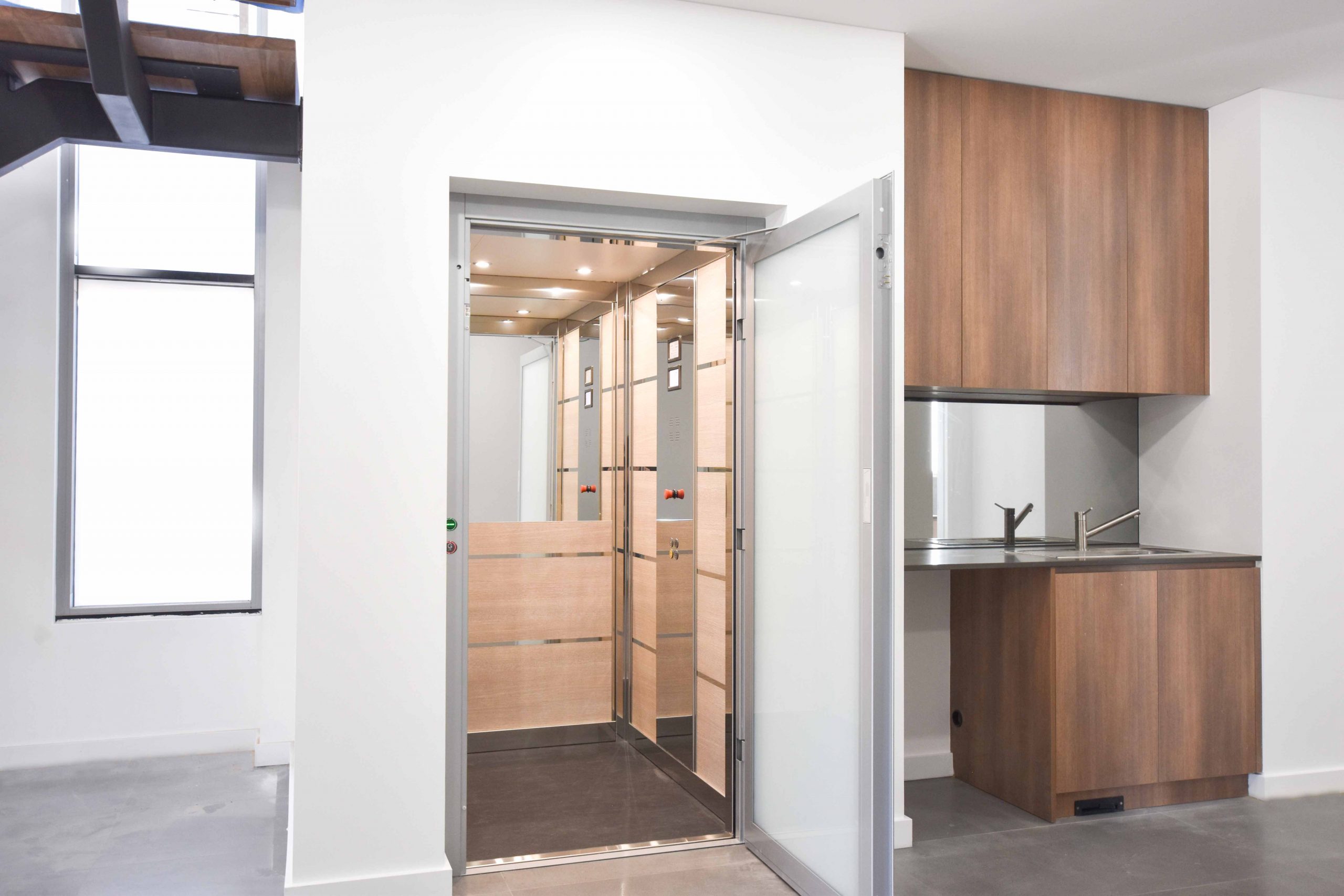 PERTH 1 (Lowres) perth residential lift next to kitchen and dining area.