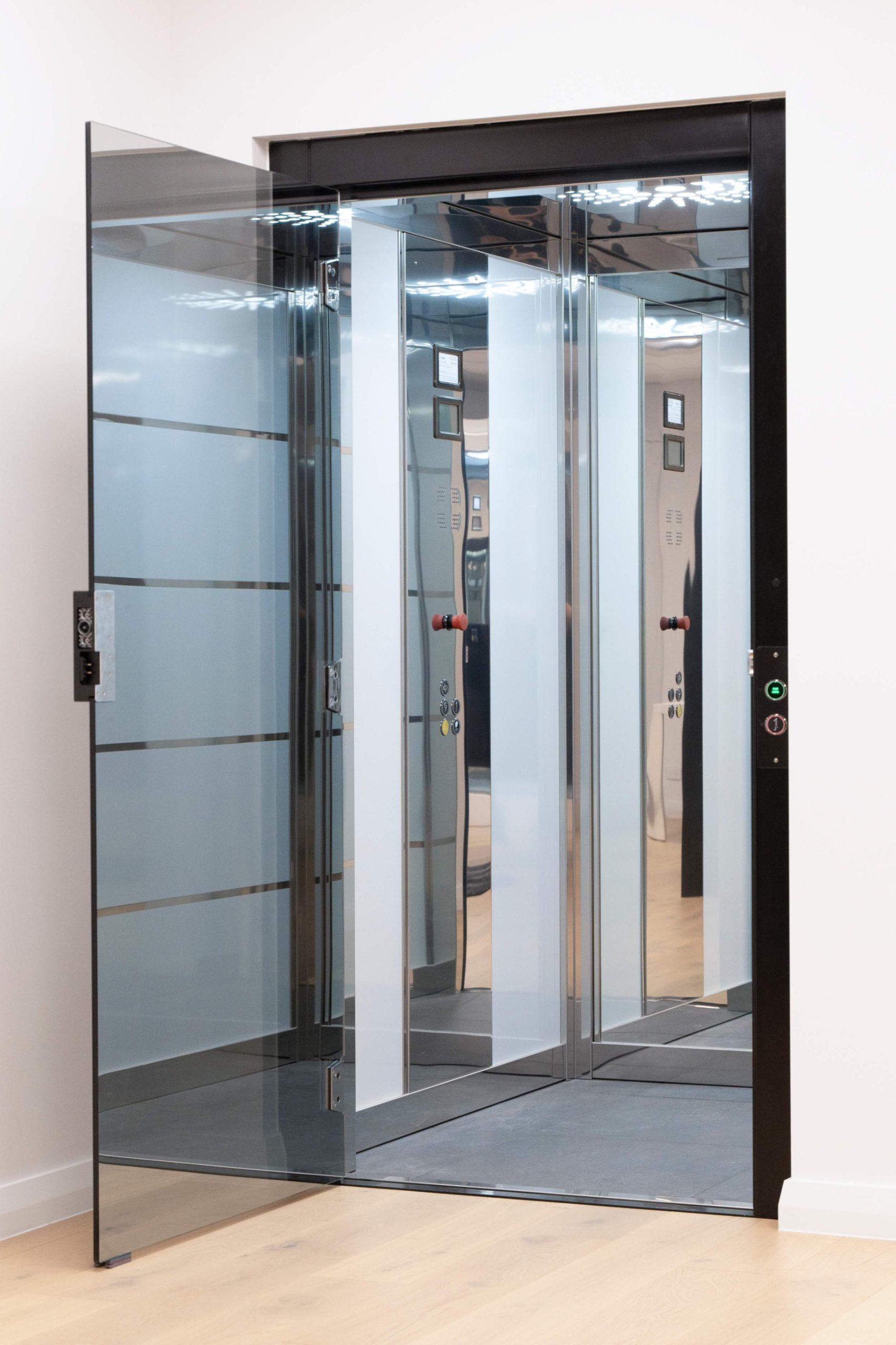 In open position 2 - Black Frameless Glass Doors 2 Modern glass elevator with open doors