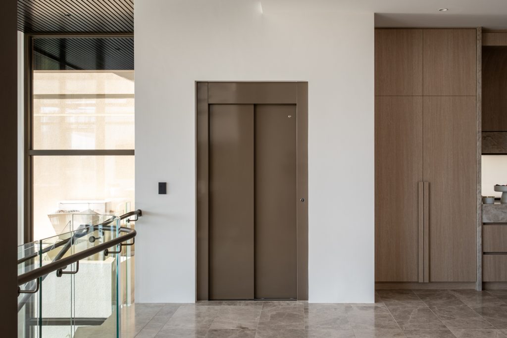 Modern indoor elevator with wooden finish