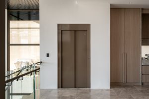 Modern indoor elevator with wooden finish