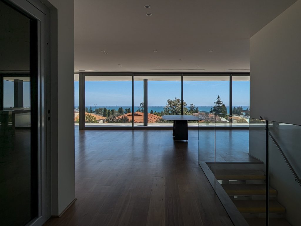 Spacious modern room with ocean view.