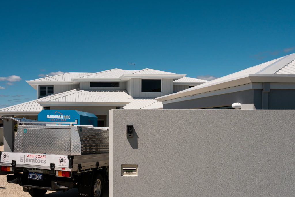 Truck parked in front of modern Australian house.