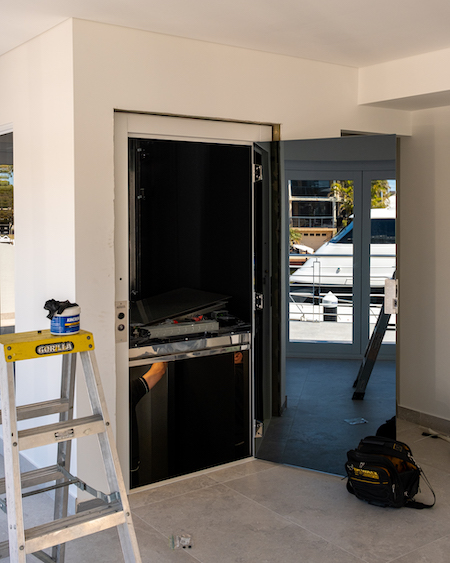 Home lift installation in process with tools.