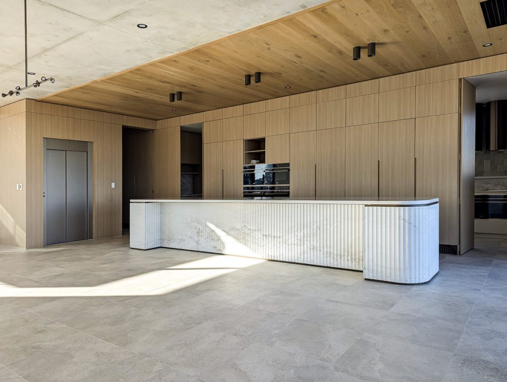 Modern kitchen with marble island and timber cabinetry