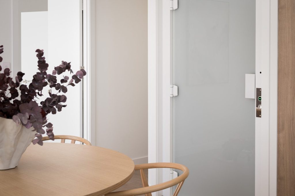 Modern interior with table, vase and lift door