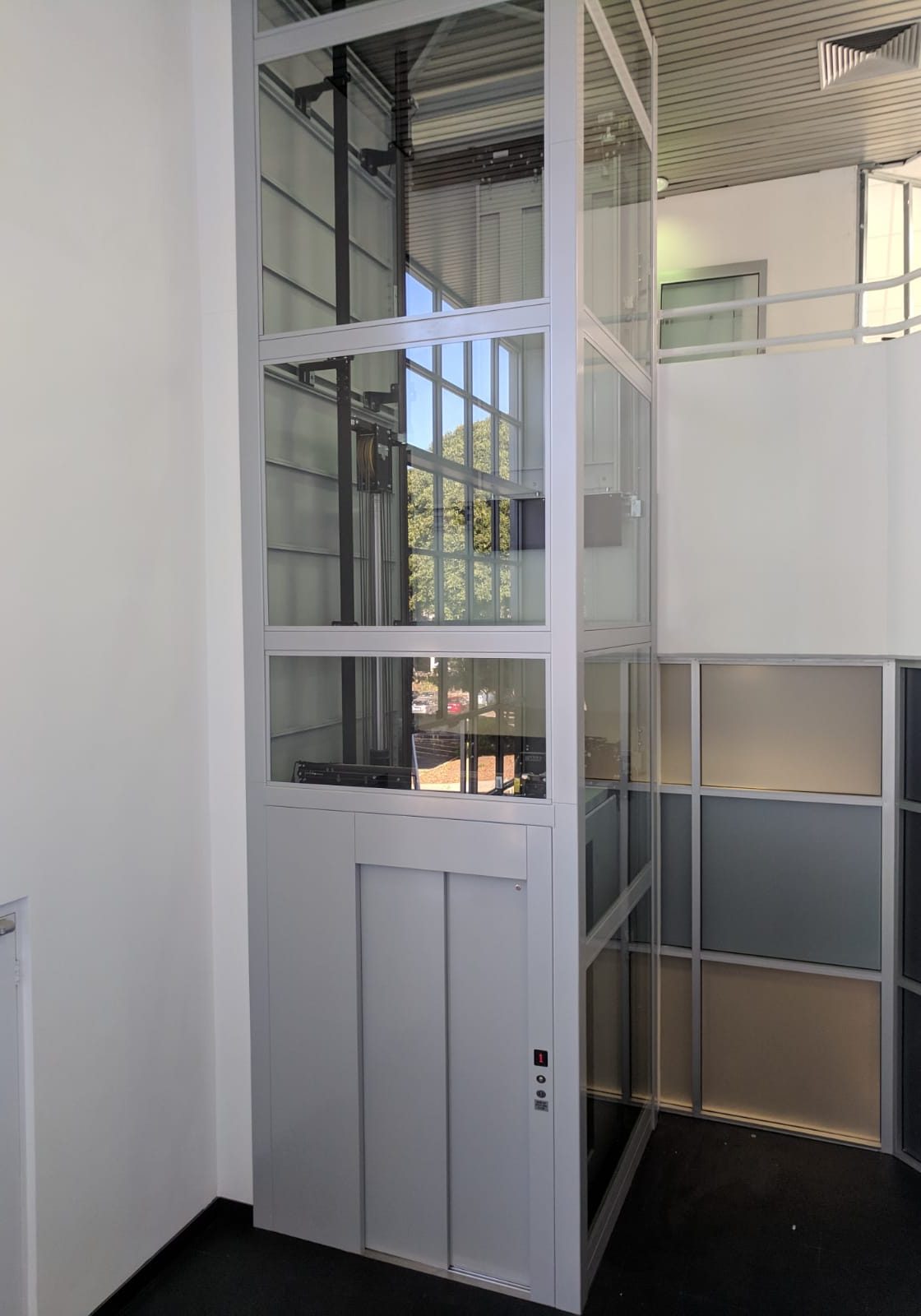 A DDA Compliant retrofitted lift with glass panels