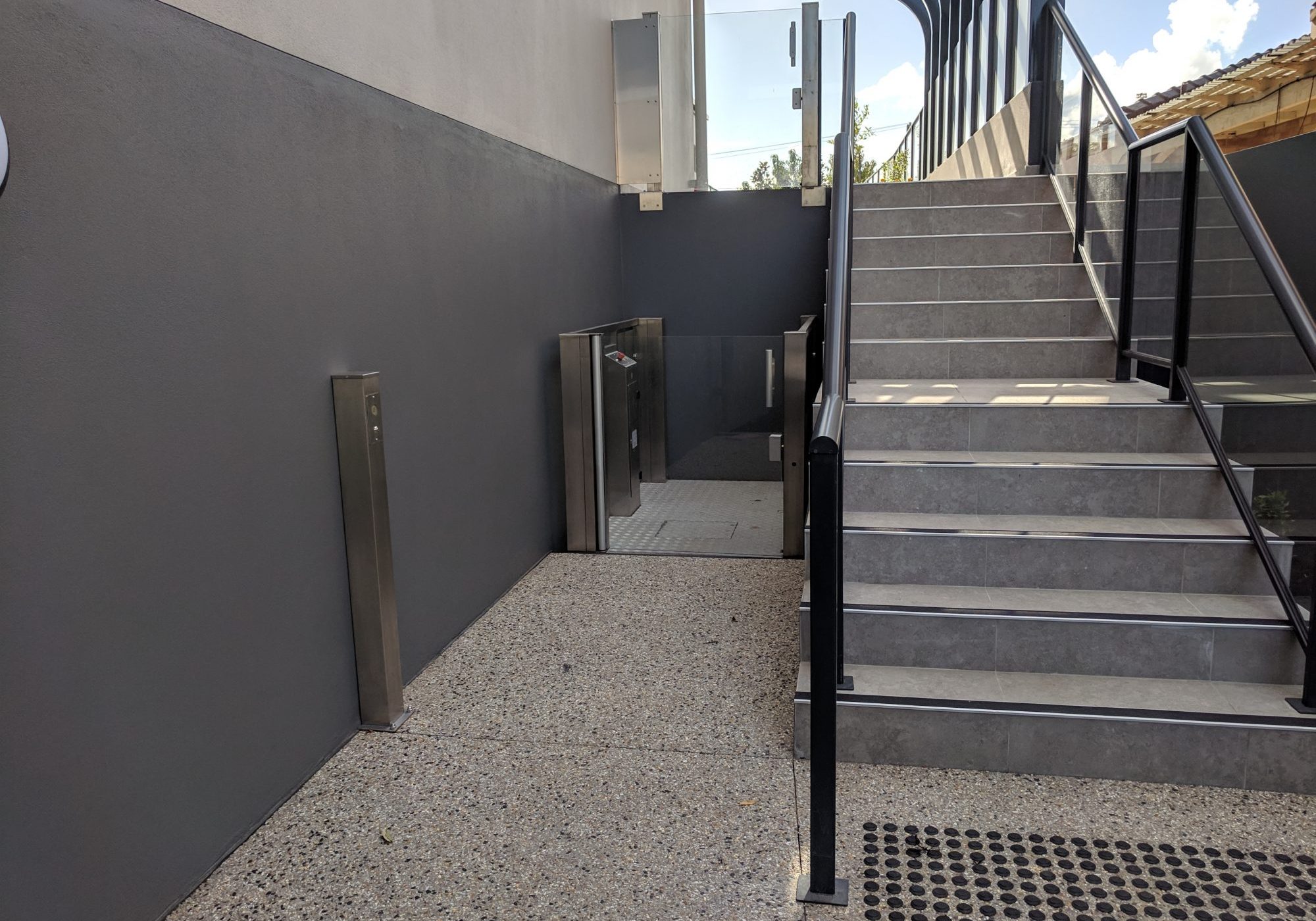 Outdoor Wheel chair lift next to stairs in Booragoon