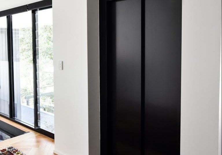 Stylish black door elevator in Cottesloe
