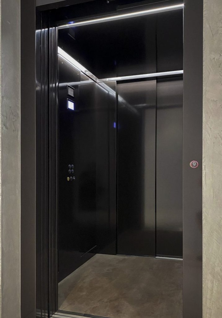 Modern black elevator with LED lighting