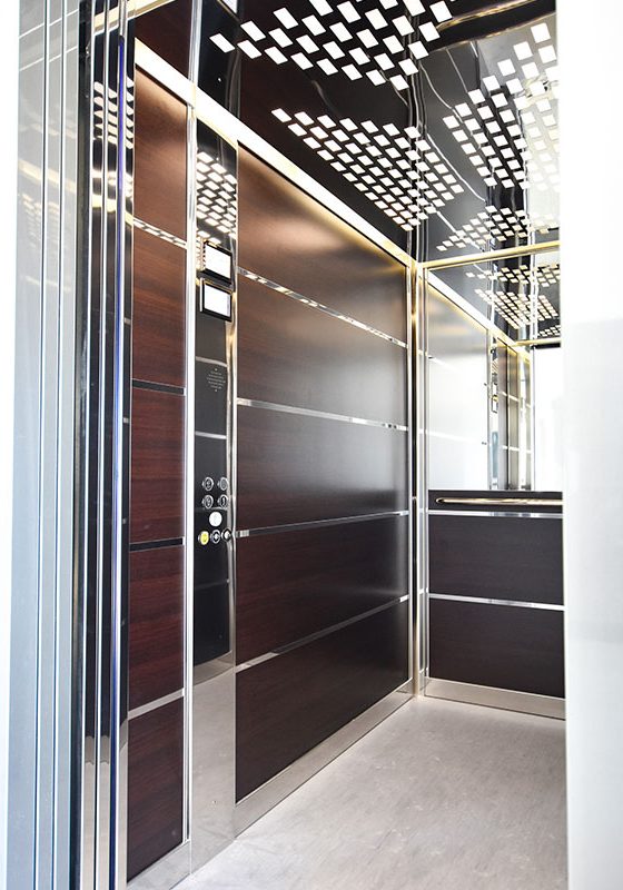 Commercial Stretcher lift with open door wood panels