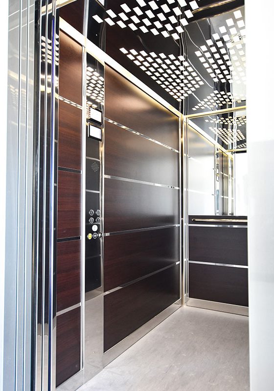 Commercial Stretcher lift with open door wood panels