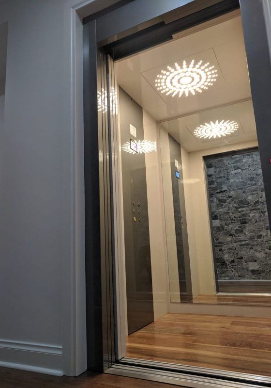 Stylish ceiling lights in a new residential lift in Dalkeith