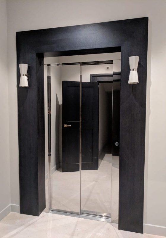 A stylish lift that has chrome doors