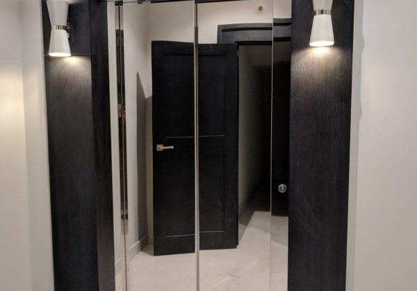 A stylish lift that has chrome doors