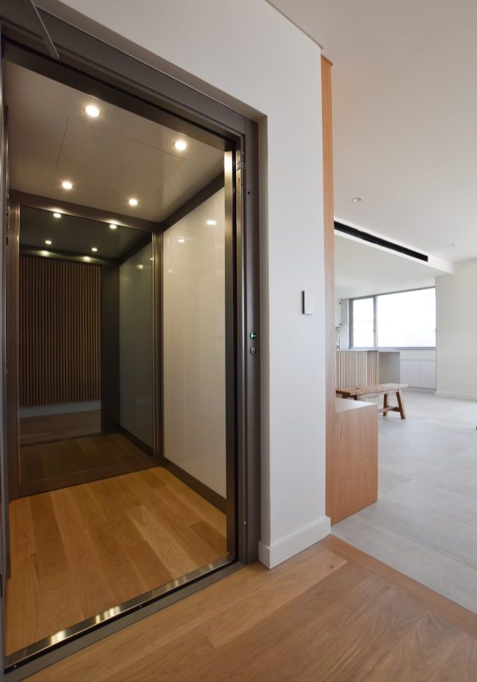 a stylish lift with an open door in a living area.