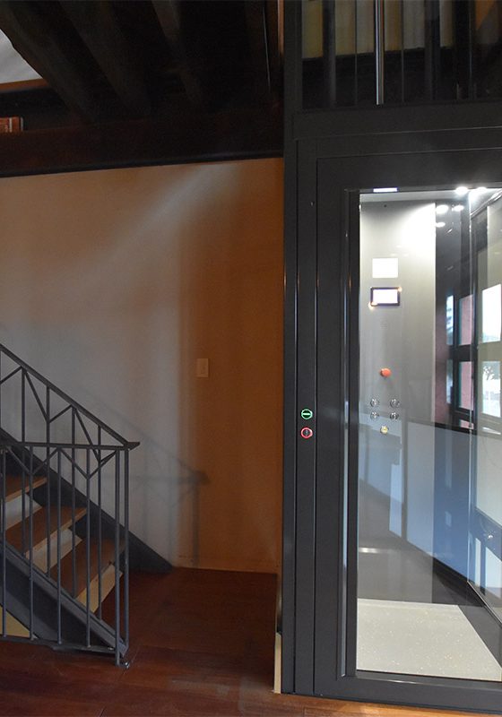Retrofitted residential lift nest to stairs in Fremantle