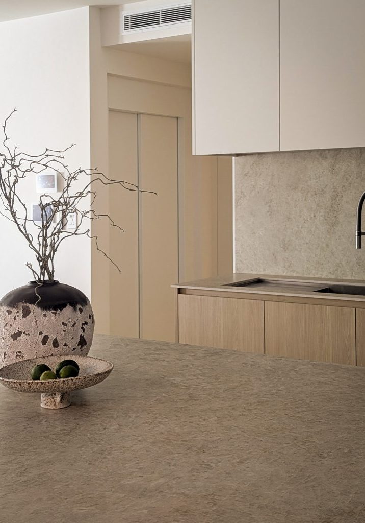 Minimalist kitchen with stone bench and ceramic vase