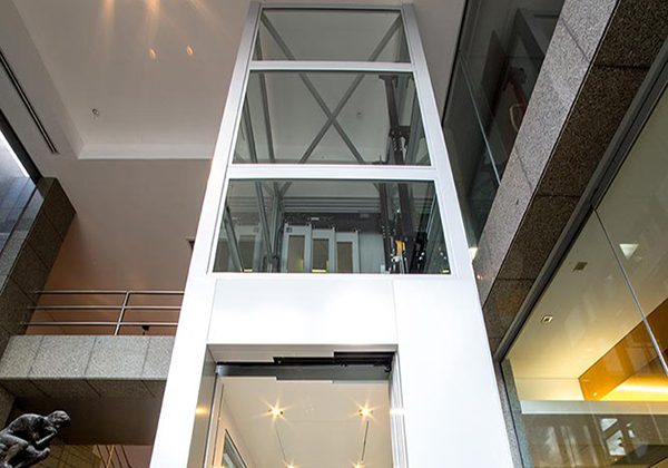 White DDA Compliant commercial lift with glass features