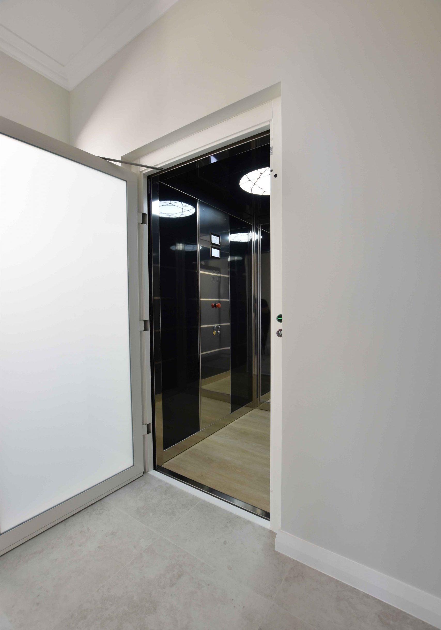 Residential sovereign lift with door open, showing internal fit out.