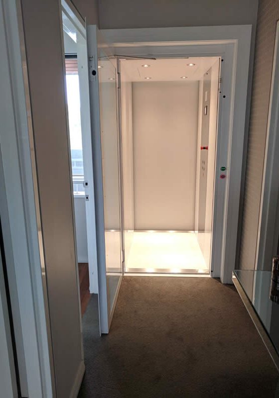 Open door of a white residential lift in Applecross