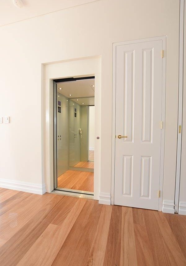 Open doors of a white residential lift in Claremont