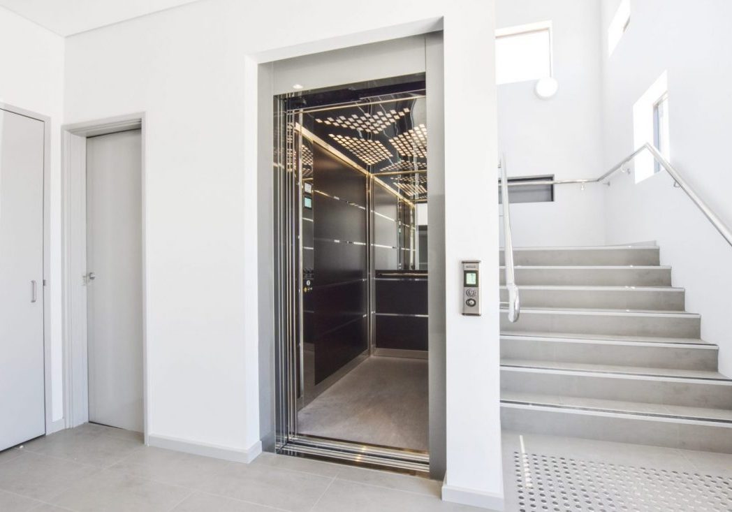 large elevator with doors open in hospital