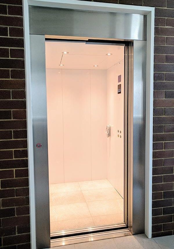 Cottesloe residential lift installation with steel doors and white interior