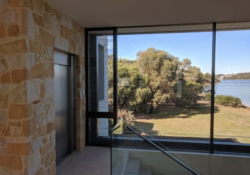 Steel doors and stone surrounding of a residential lift