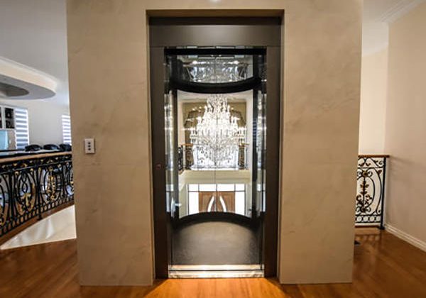 Open doors of a panoramic residential elevator in Mariginiup