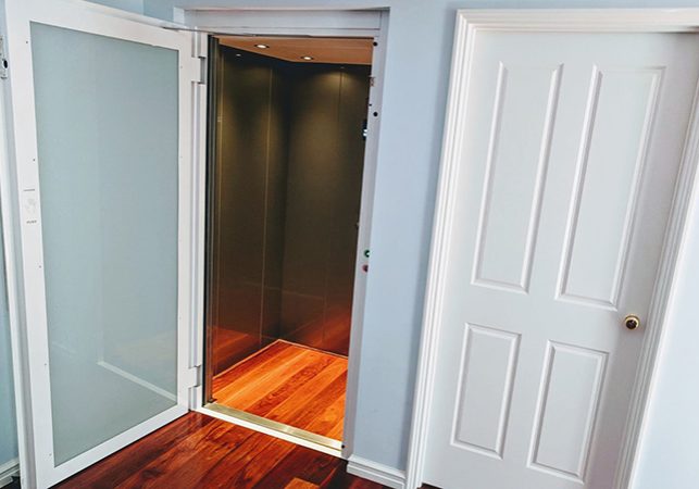 Open glass door of a residential lift in Mount Pleasant