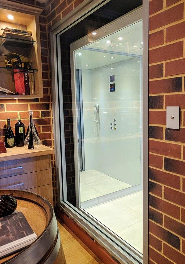 Glass walls on a residential lift in a cellar
