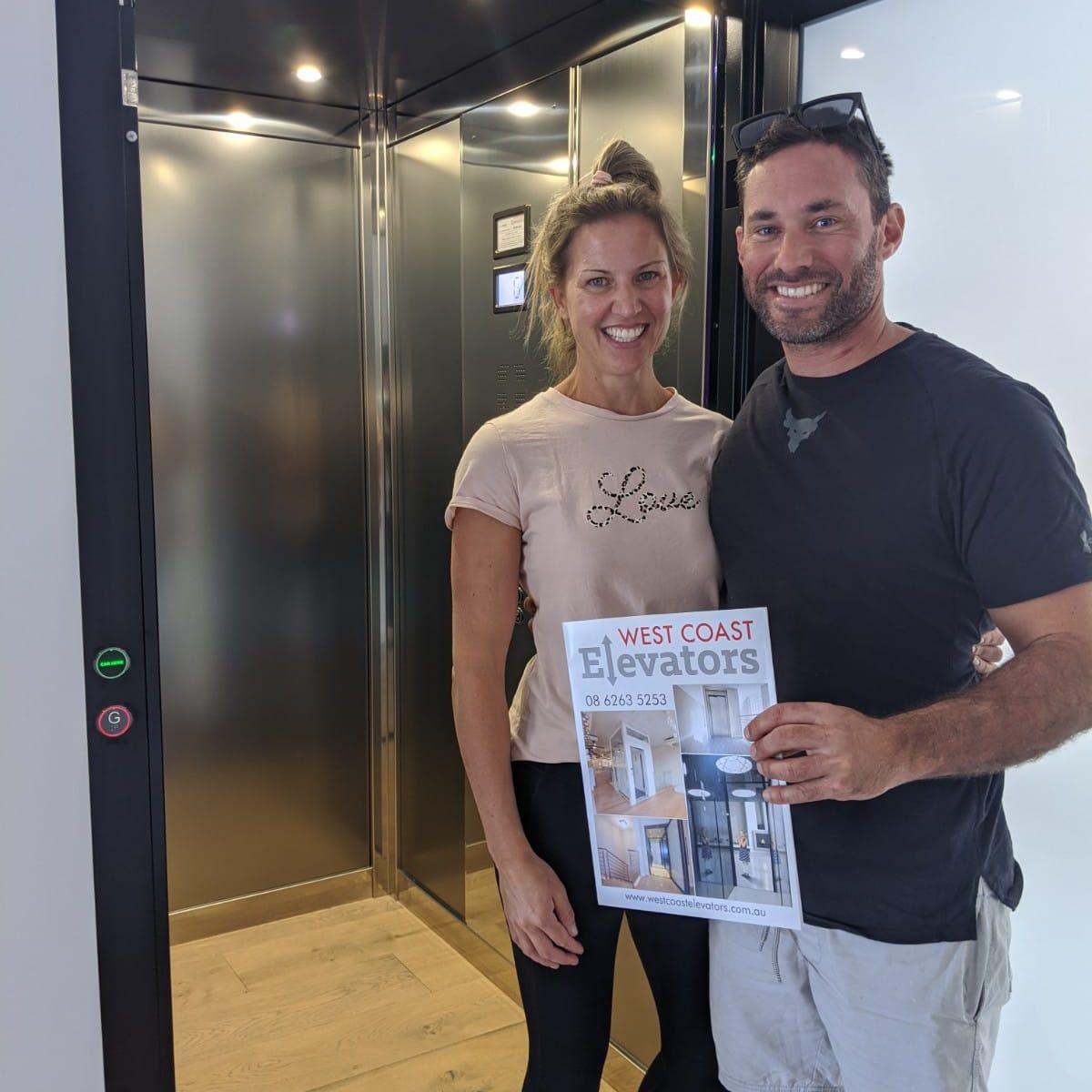 customers in front of their Sorrento residential lift customers in front of their sorrento residential lift