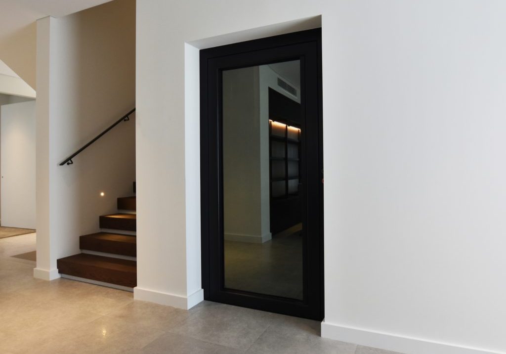 stylish home lift with tinted glass